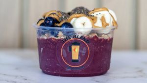 Protein Power bowl with acai base, banana, blueberries, peanut butter, granola, and chia seeds.