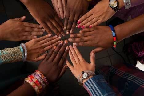 Multi cultural hands shutterstock 667612264