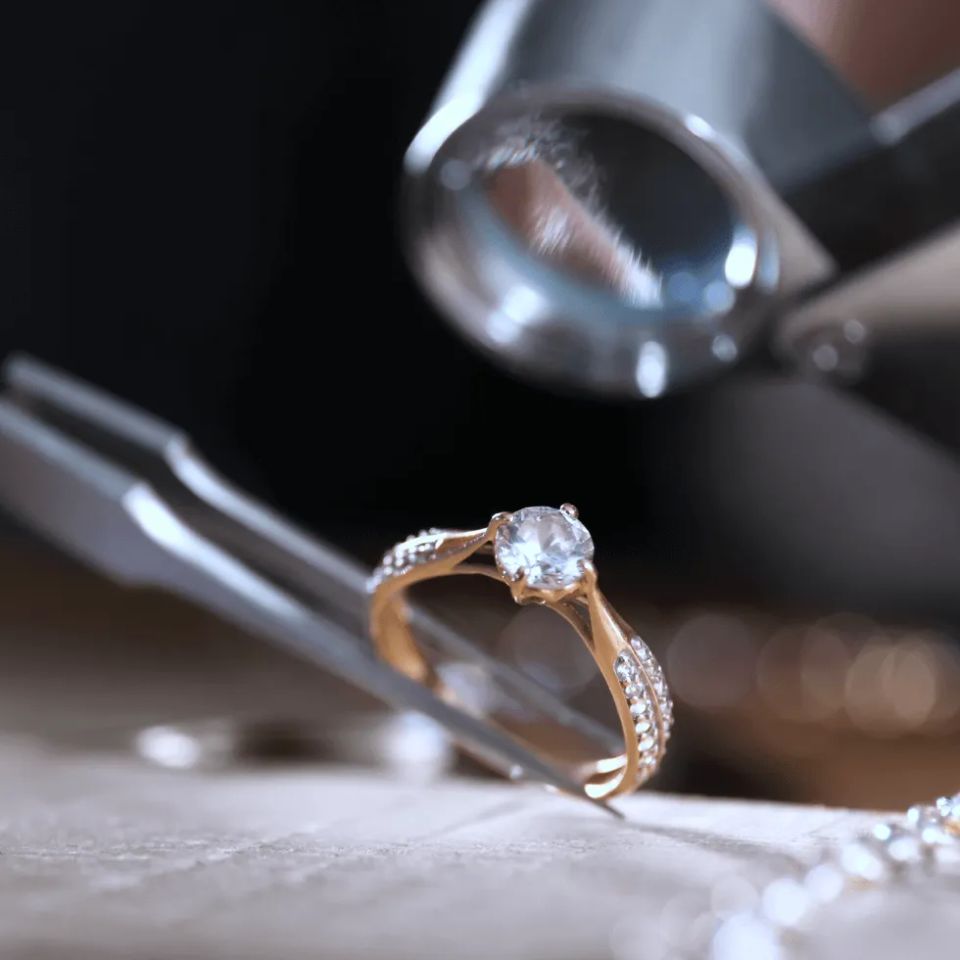 Jeweler inspecting diamond ring