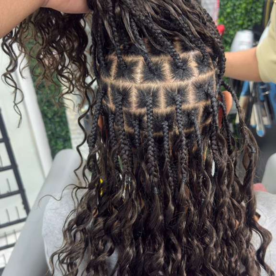 woman with extensions being put on