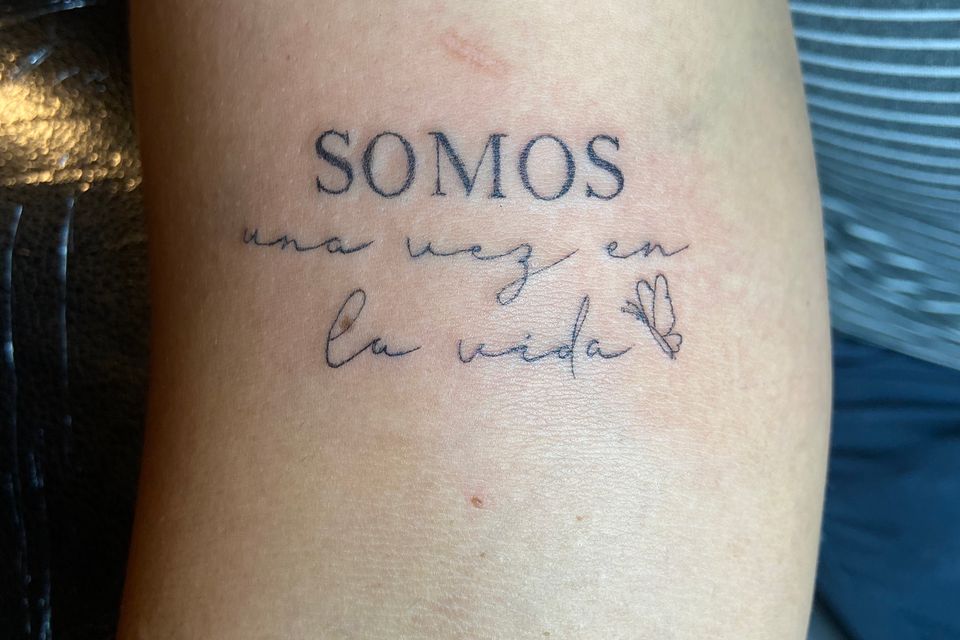 Image of a saying tattood on the arm