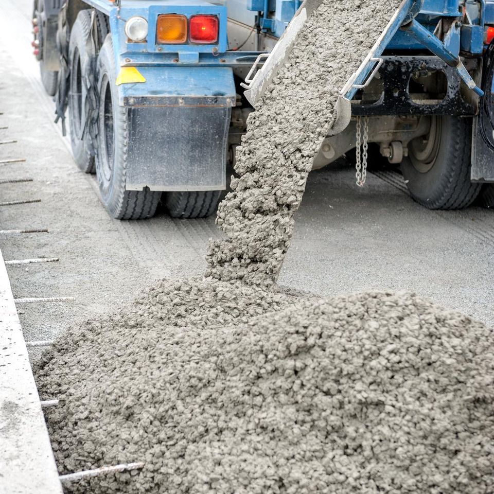concrete truck laying down concrete