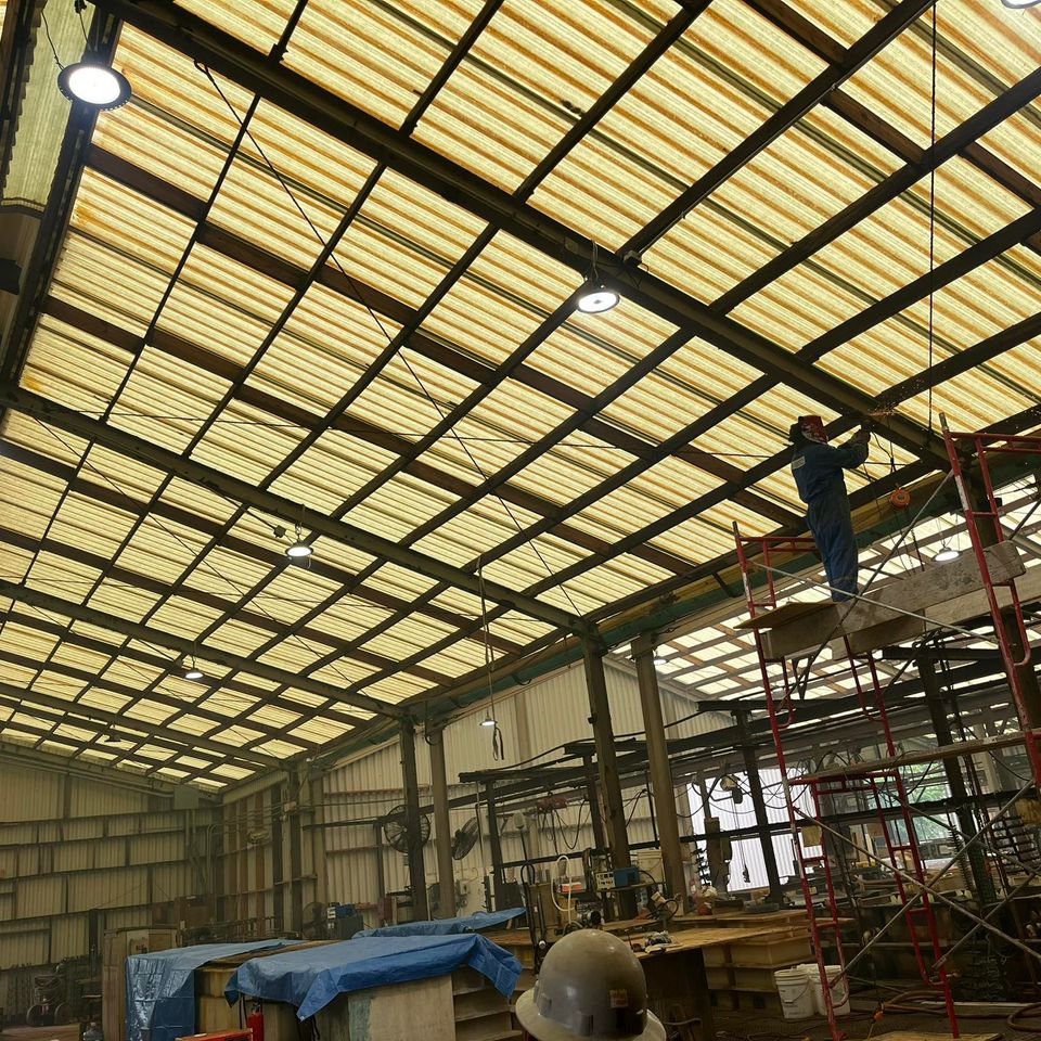Marquez Welding installing steel support beams for crane system in Houston industrial building