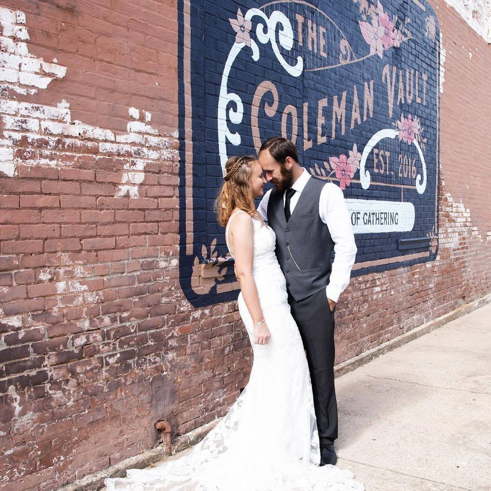 Bride and groom w coleman vault logo