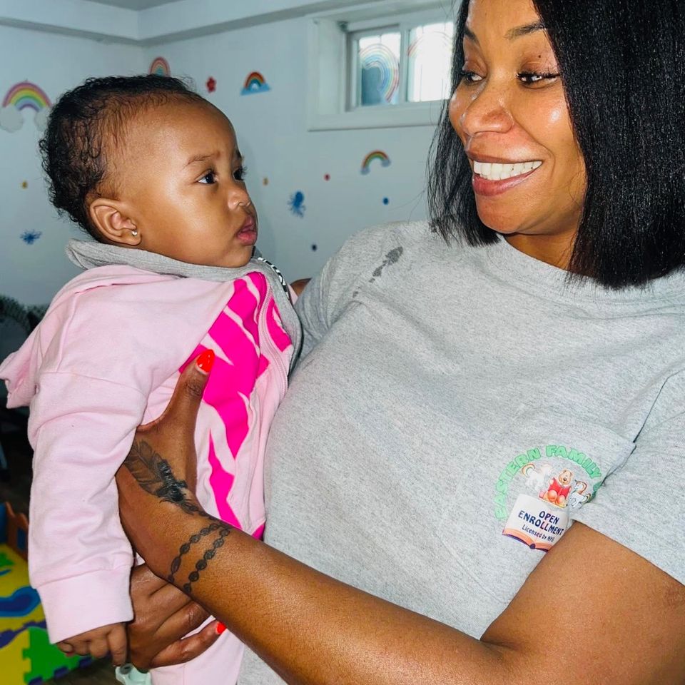 Sam smiling with baby