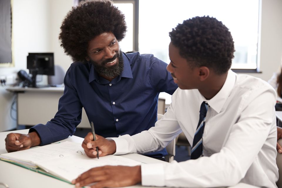 High school tutor giving uniformed male student on 2024 10 19 02 09 55 utc