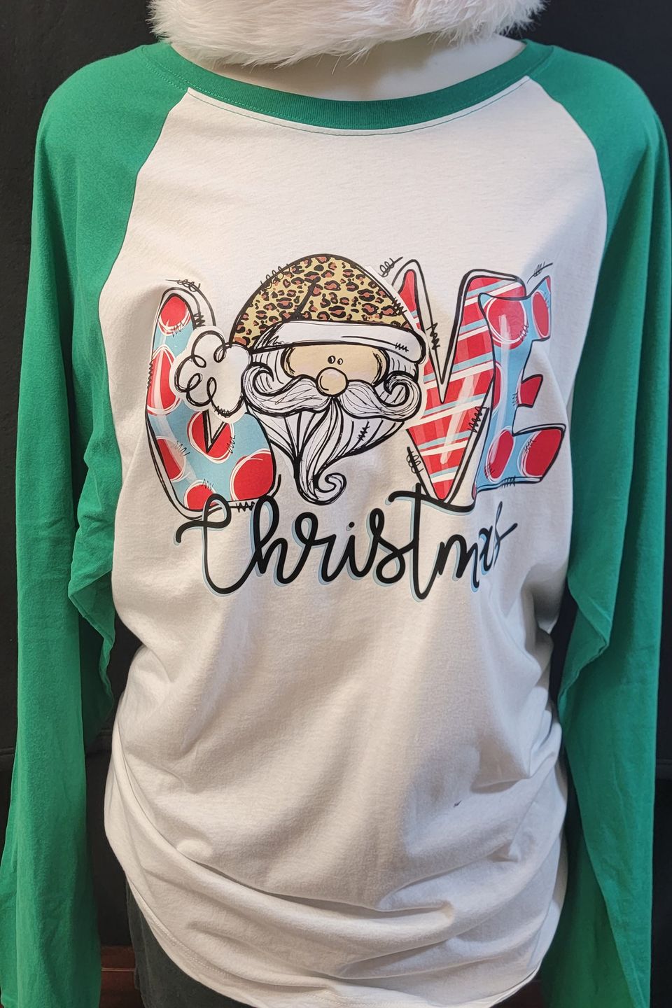 Example of a "Love Christmas" t-shirt using direct-to-film transfer (DTF) from SaRi's Creations.