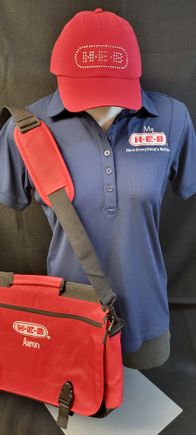 HEB Logo applied to blue shirt, red cap, and laptop bag bt SaRi's Creations