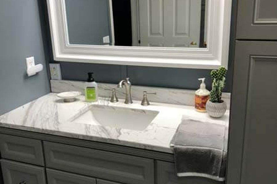 Elegant bathroom remodeling project with marble countertops and custom cabinetry in Knoxville TN