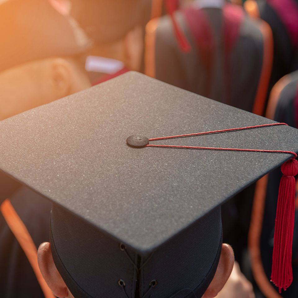 Bigstock graduates wear graduation gown 280441774
