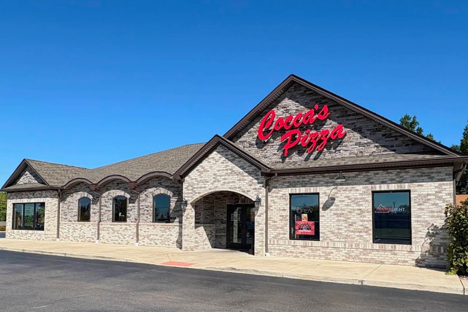 Cocca’s Pizza Canfield, Ohio location with a stone exterior, arched entrance, and prominent red sign.
