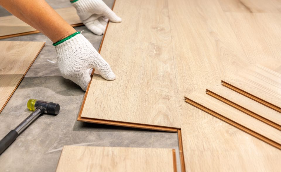 Worker Installing Interlocking laminate floor