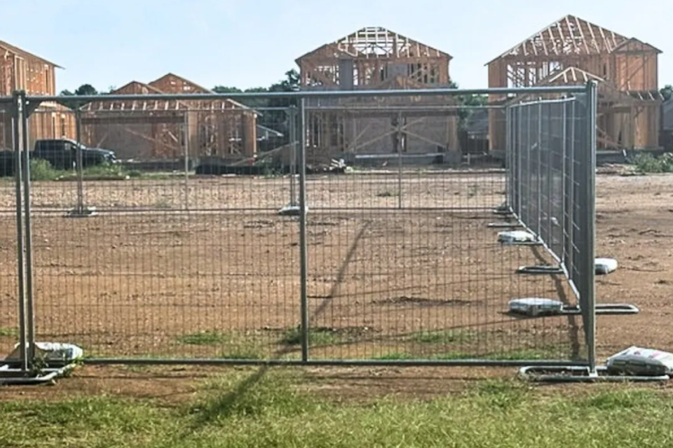 Temporary fencing securing equipment and site perimeter at a mission critical project in Turkey, TX