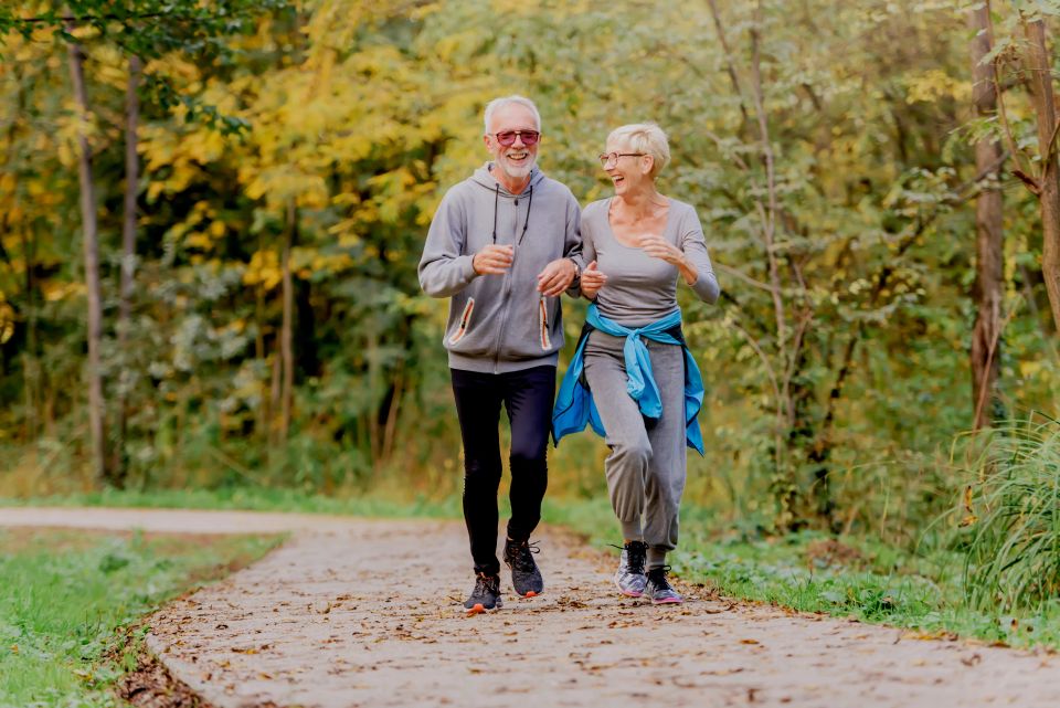 Senior couple jogging in the park