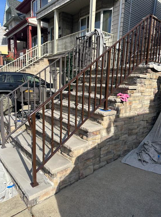 Freshly refinished exterior railing on staircase