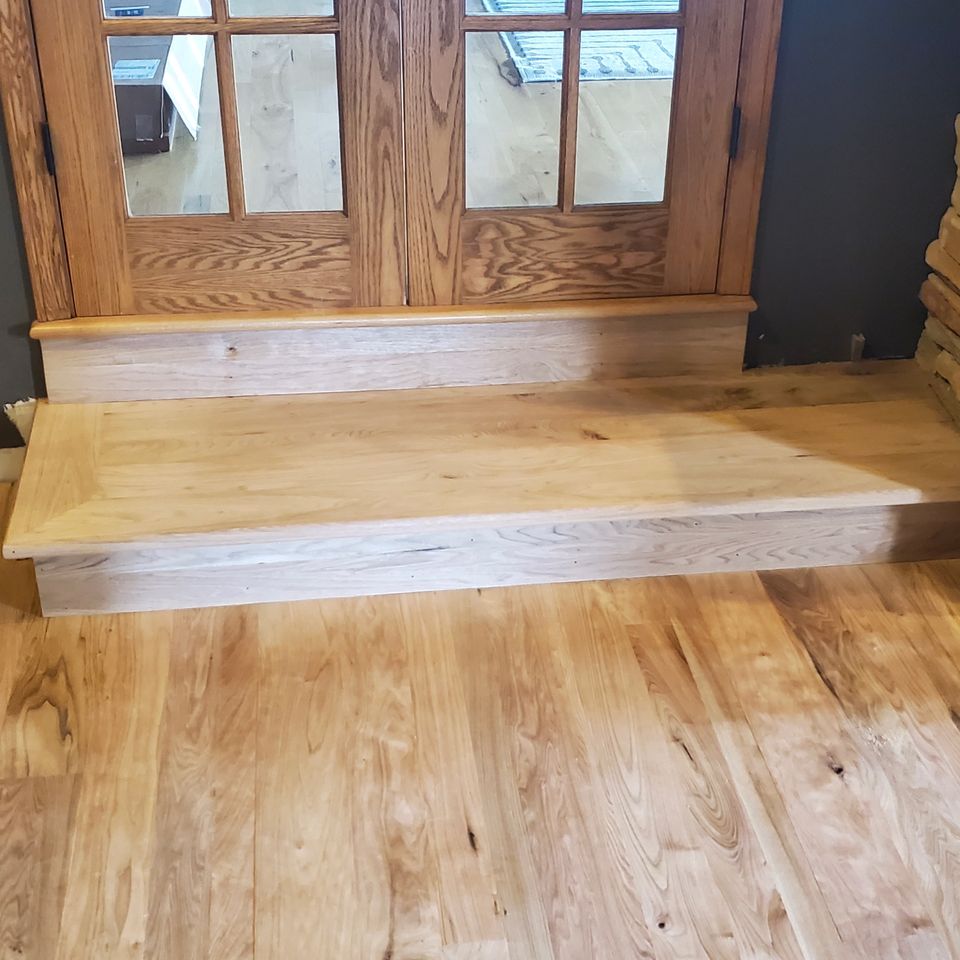 Hardwood flooring job with a matching step, done by Siti Floors of Northeast Ohio