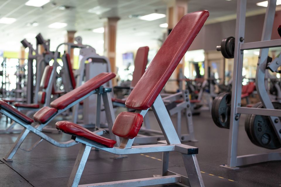 Red padded workout benches at Maximus Gym in Riverhead