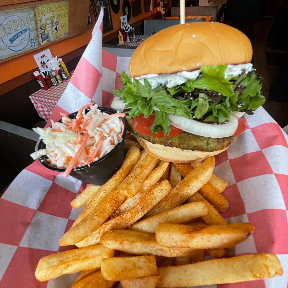 Burger with coleslaw and fries from Inferno The Restaurant in Sound Beach