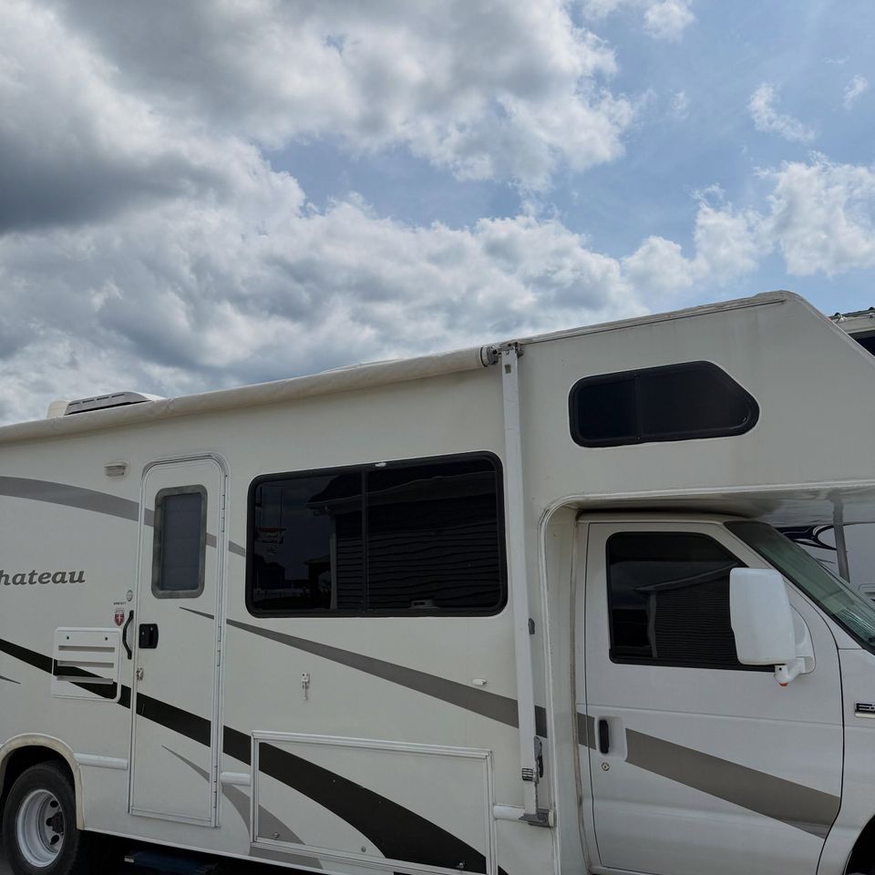 Class C motorhome with tinted side windows after RV window tinting