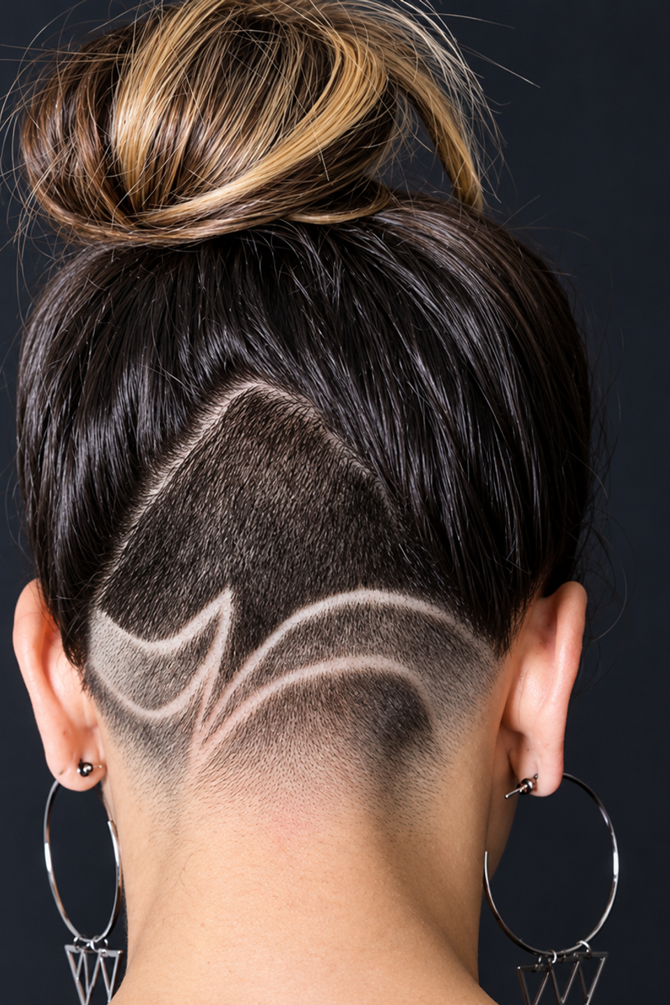 This image shows a woman showing off a fade from Chay's Barber Studio. 