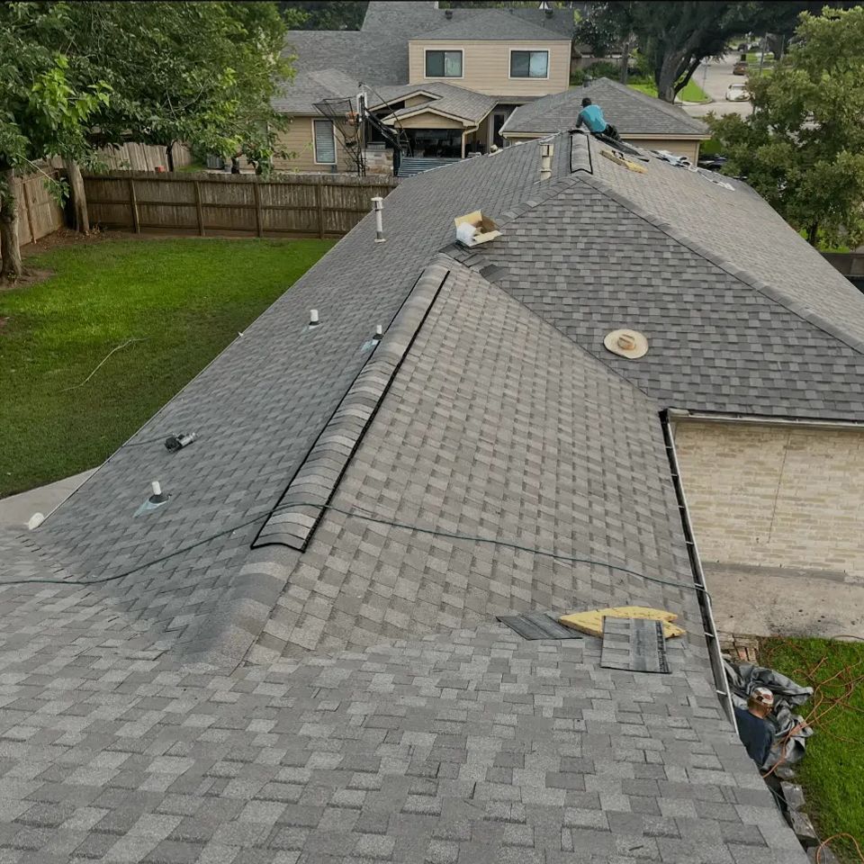 Aerial view of a residential roof installation project by Media Construction in Spring Texas