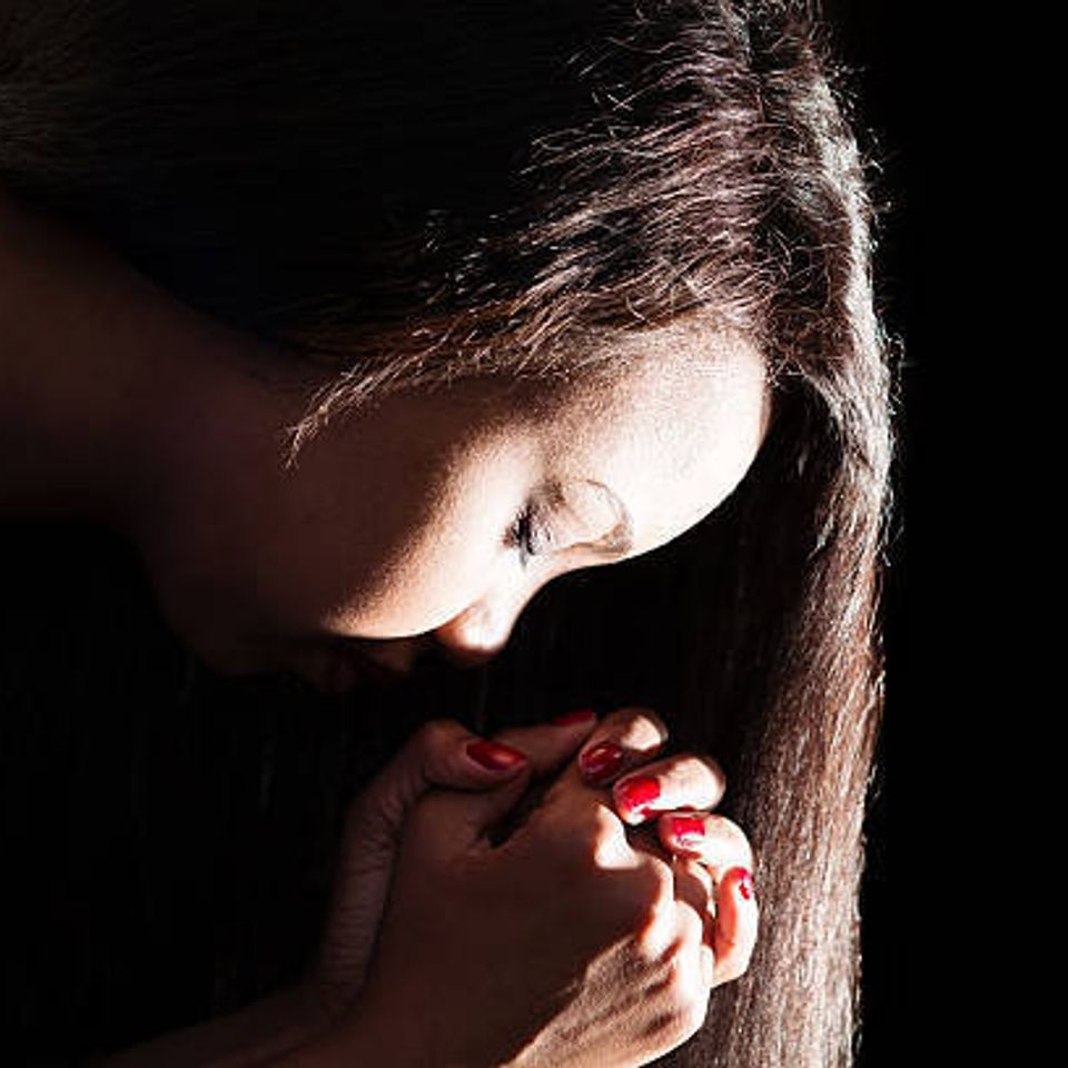 Young woman praying