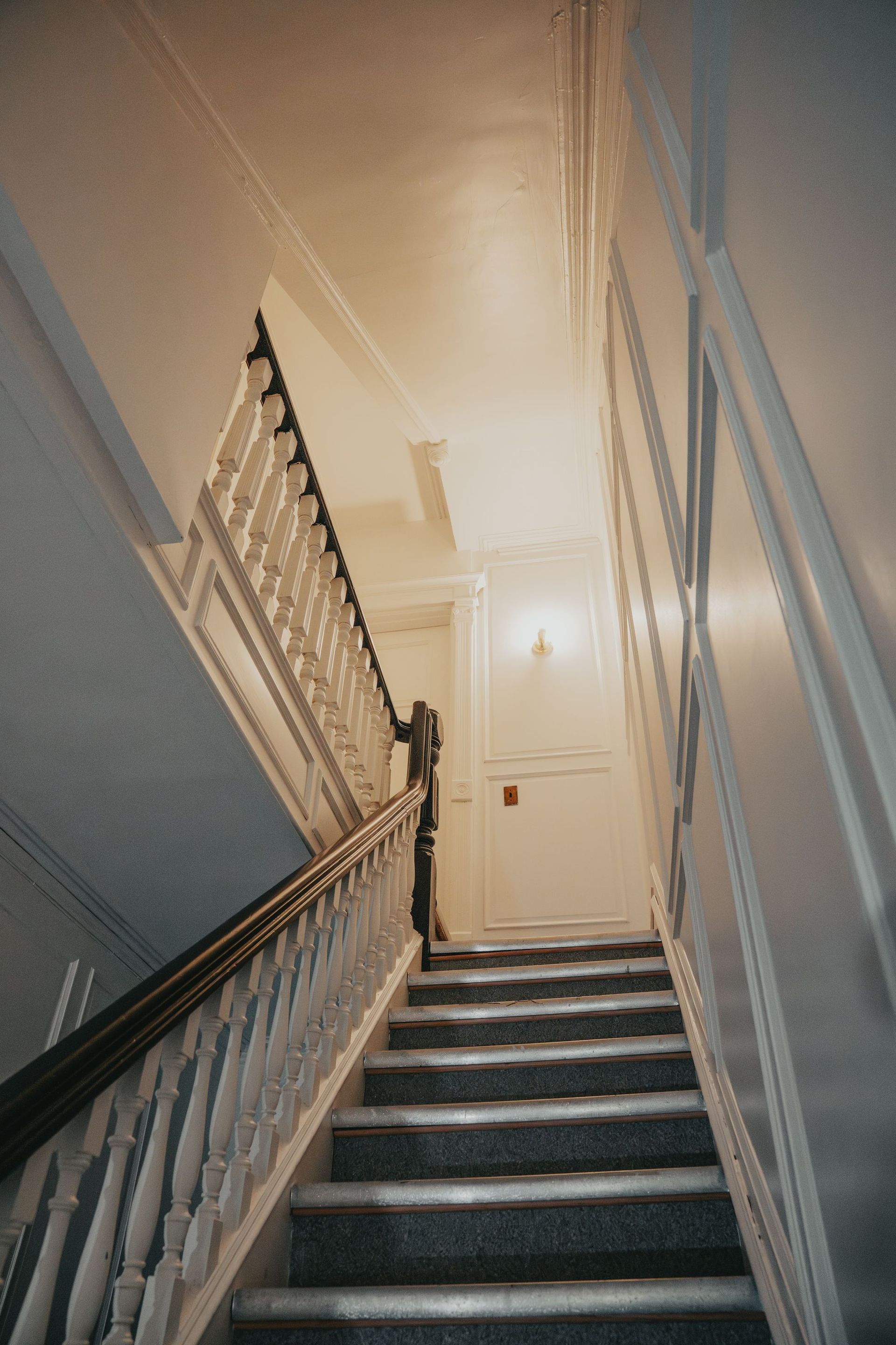 Stair landing with wood trim at 85 8th Ave in Park Slope, Brooklyn