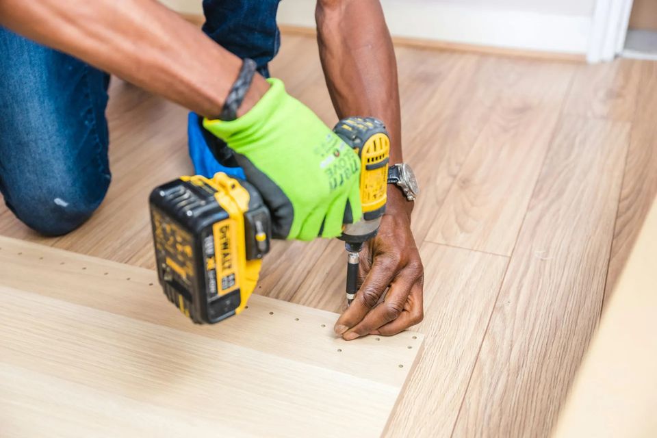 handyman fixing floor