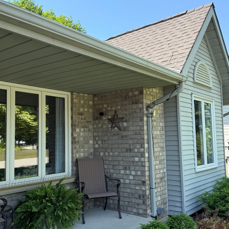 Brightened gutter and soffit line on a brick home after exterior cleaning in Tillsonburg Ontario