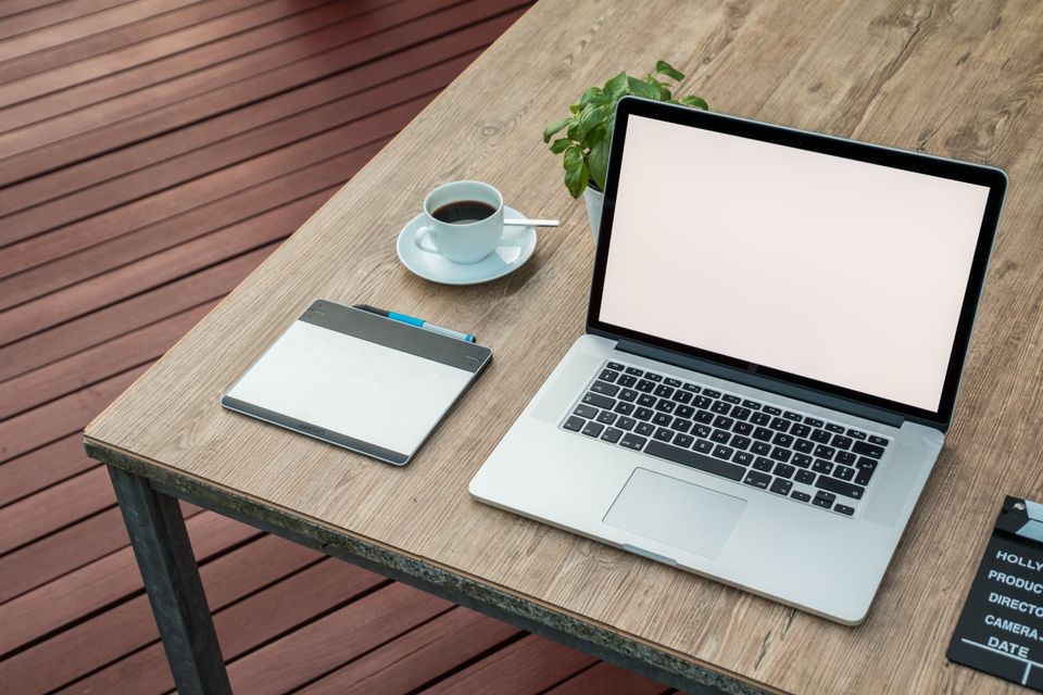 Beach Publisher Website Design Services. A laptop computer with a website builder on the screen