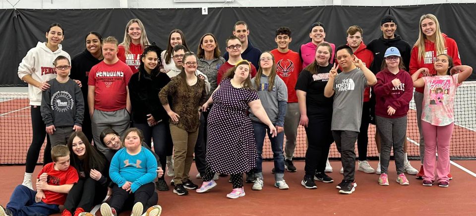 Group photo of Down Syndrome Association of the Valley members, volunteers, and supporters at an inclusive community program.