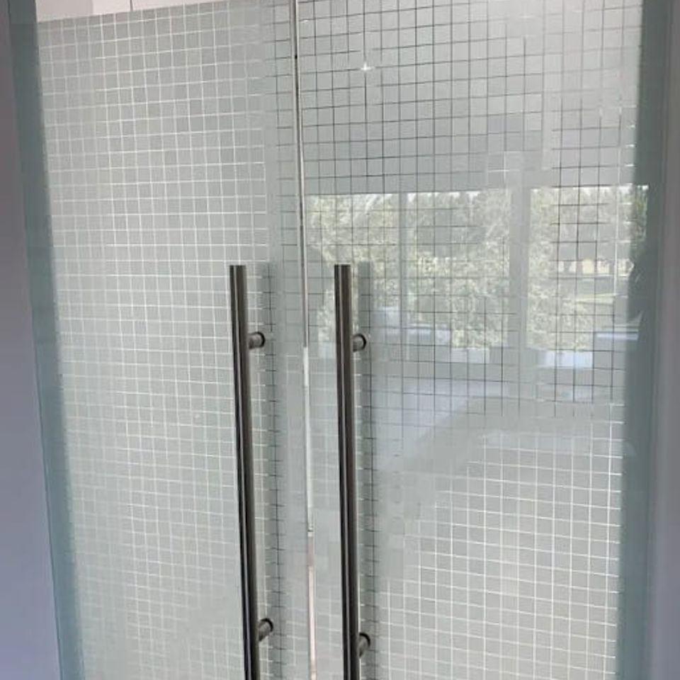 Frosted decorative window film installed on glass shower for privacy