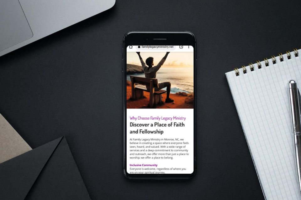 Smartphone displaying Family Legacy Ministry website in Monroe North Carolina with message inviting all to experience faith, fellowship, and inclusive community.