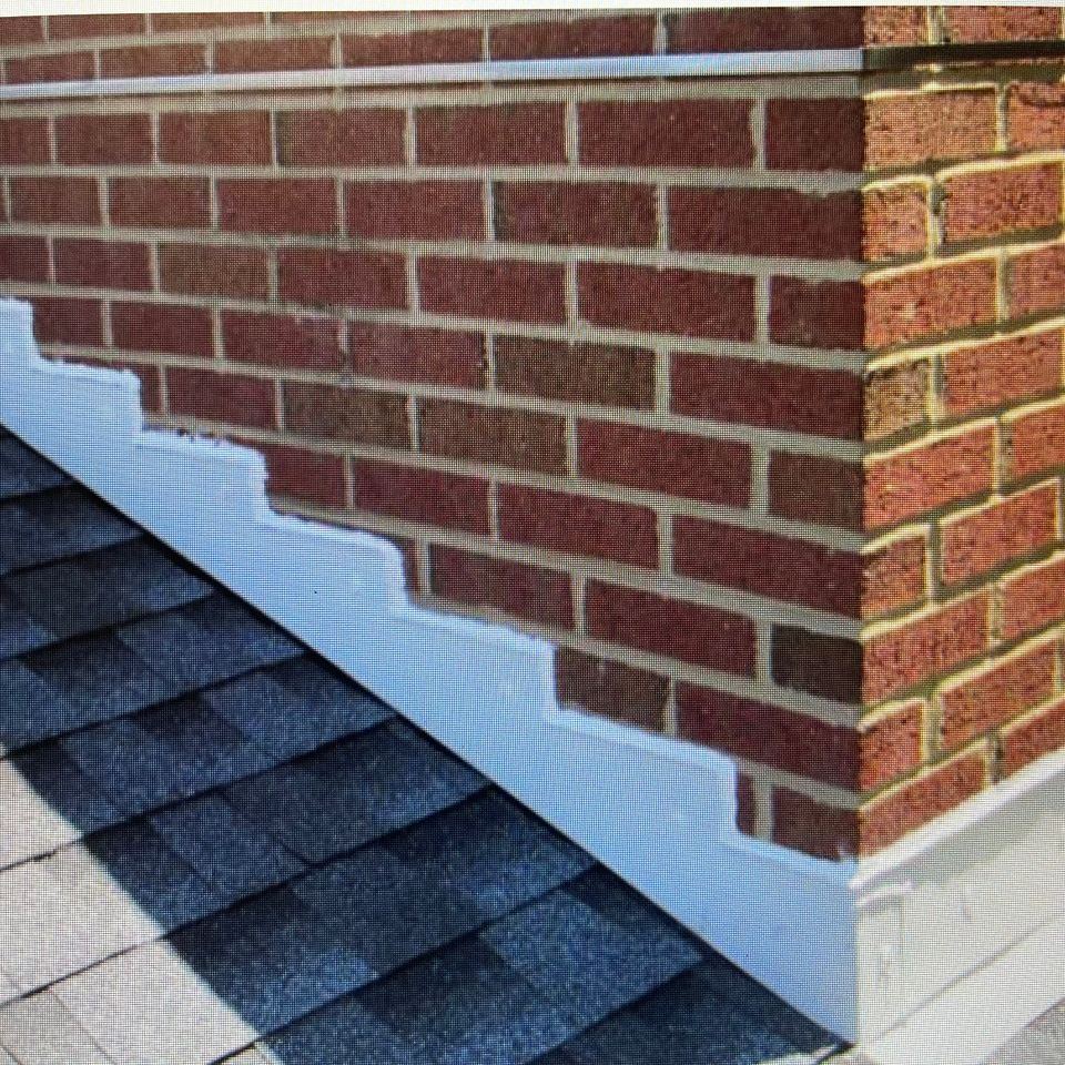Chimney with newly installed flashing designed to help prevent roof leaks and water intrusion.