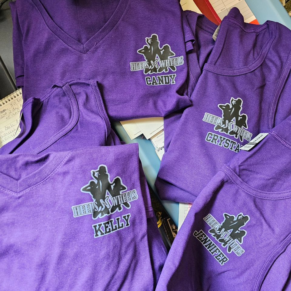 Purple Heels 'n Wheels shirts customized with individual team member names.