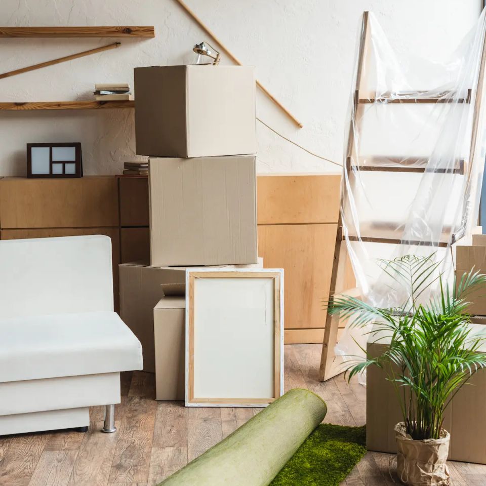 Cardboard moving boxes and rolled carpet in apartment ready for move in cleaning service in Virginia Beach VA