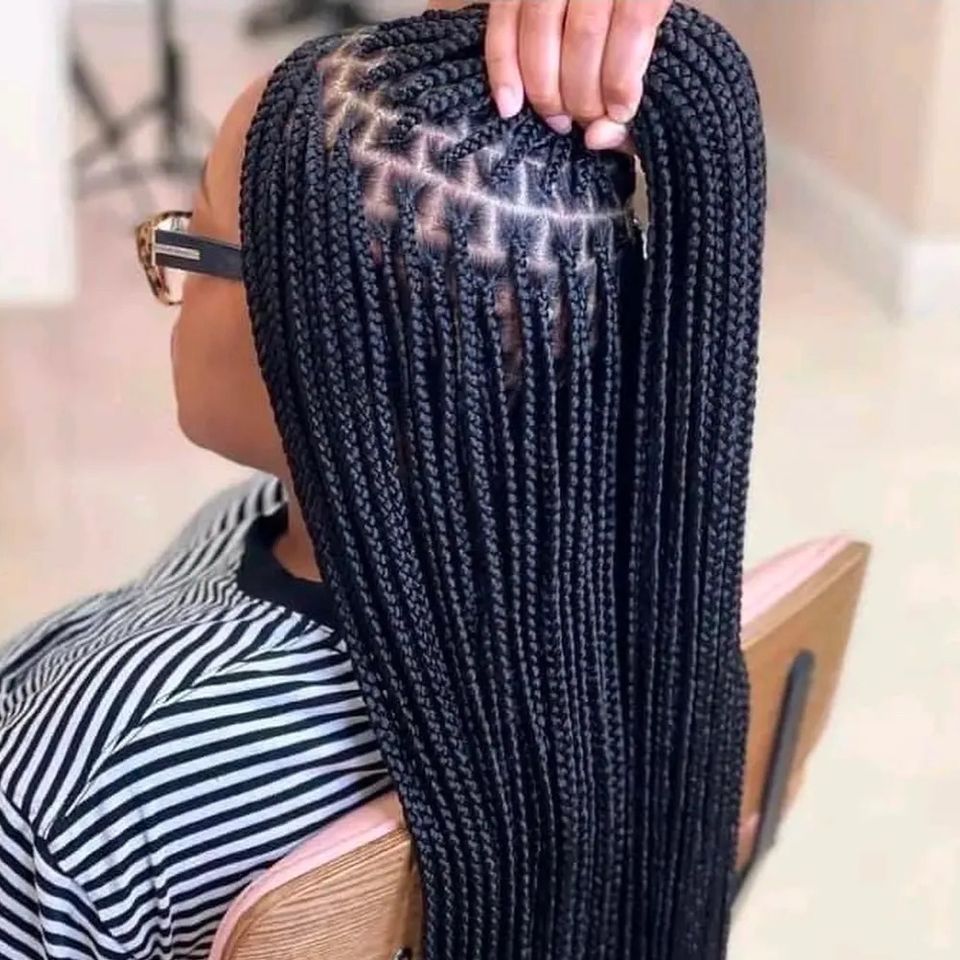 Long neat knotless box braids with clean parts after a braiding service in Los Angeles CA
