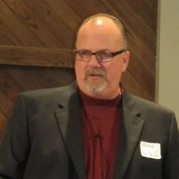 Pastor Butch Hodge speaking at an event