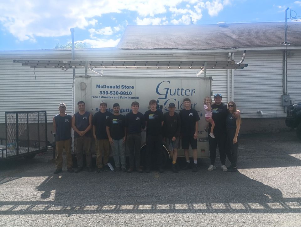 Gutter Clear LLC team members gathered in front of the company facility, representing their commitment to quality service and customer satisfaction.