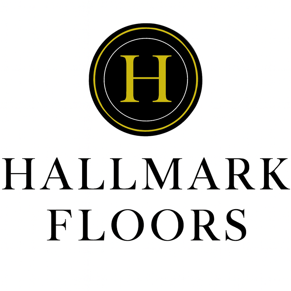 Hallmark Floors logo with a stylized yellow “H” inside a circular emblem, followed by cursive white “Hallmark Floors” text on a black background
