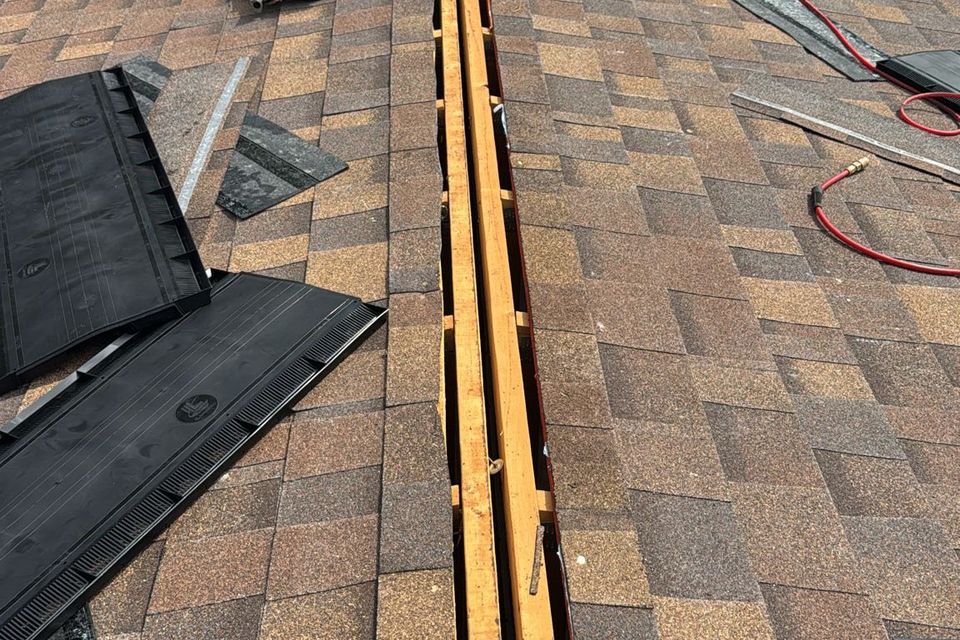 Workers installing a 100% financed new roof for Teal Roofing and Sheet Metal.