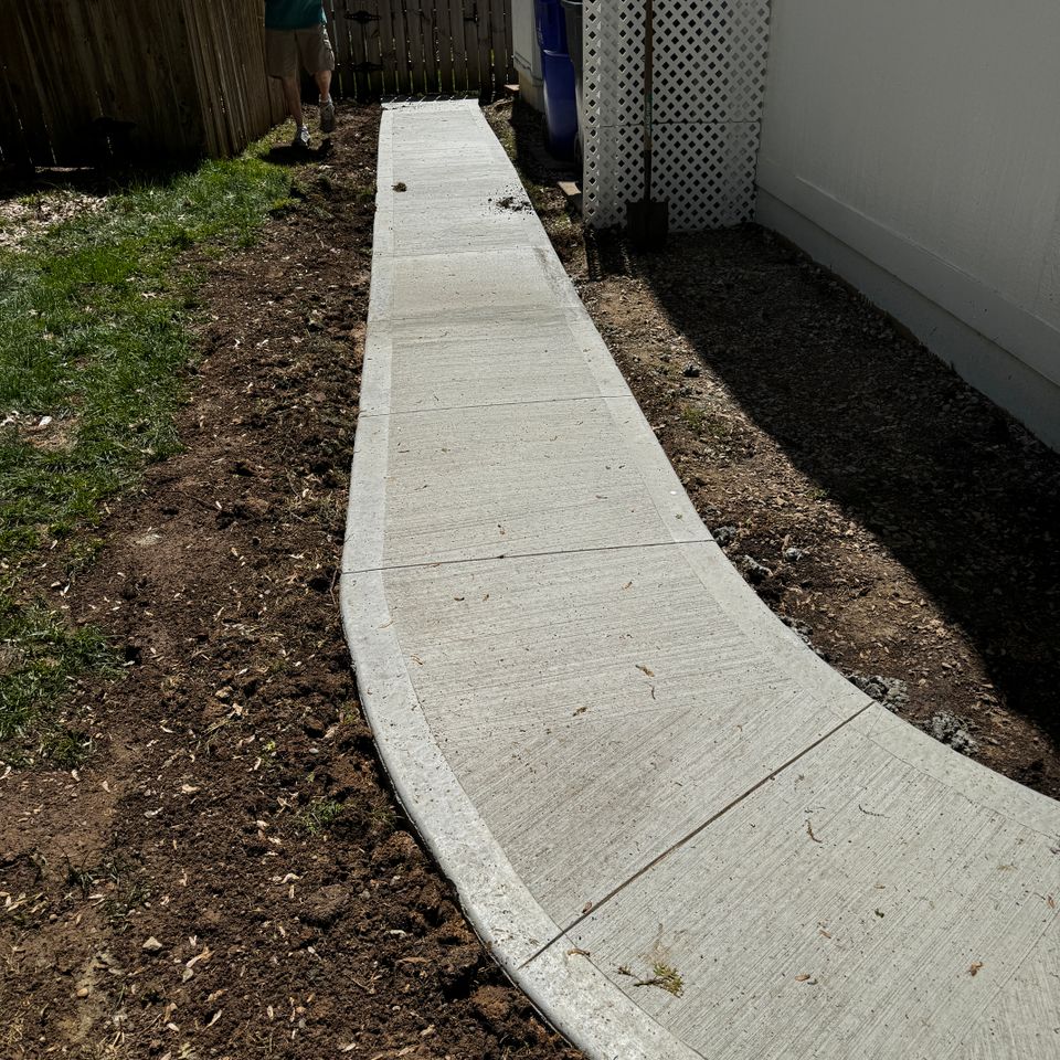 Newly laid concrete pathway patriot pro exteriors kansas city ce3096fd a307 4f46 b955 c9d12a040d3b