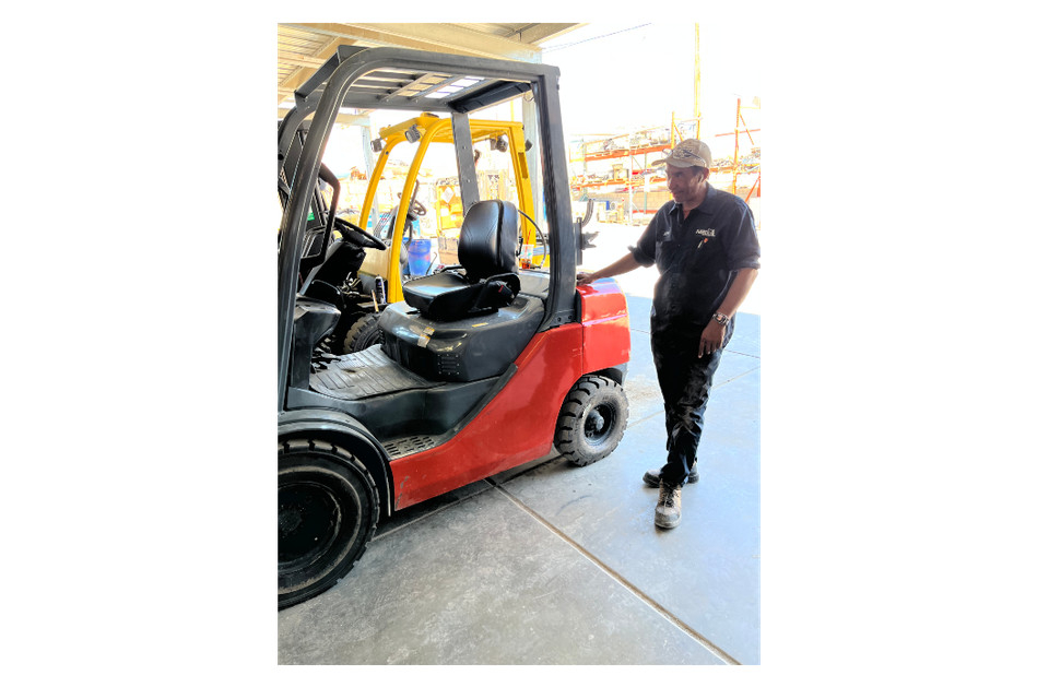 Image of John and a used forklift for sale
