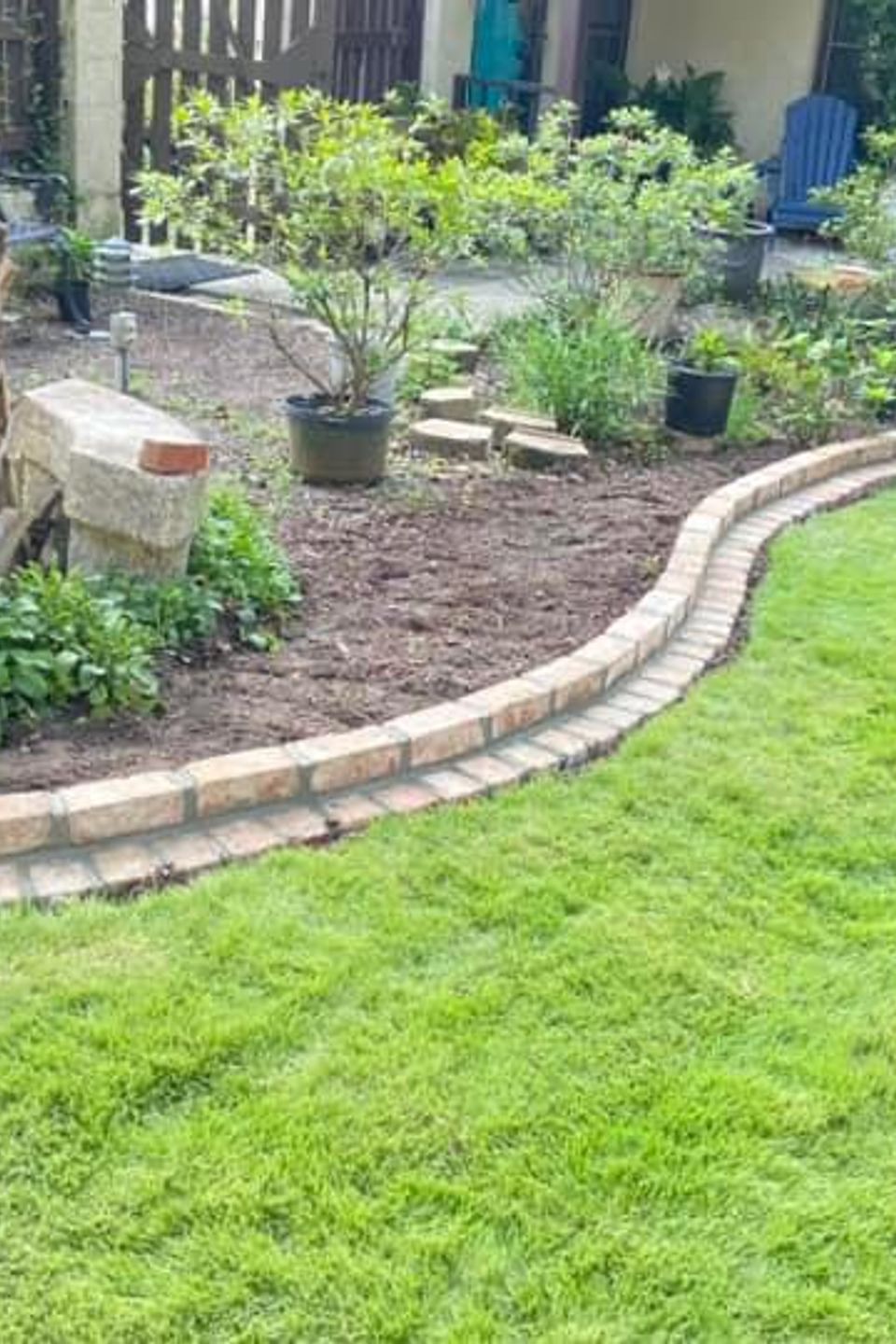 "Decorative stone landscape edging installed by Gabino Landscaping in Myrtle Beach, South Carolina."