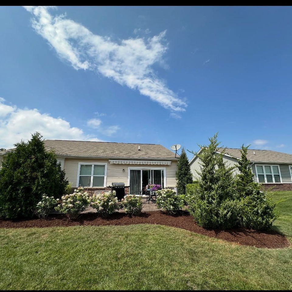Wide view of a professional mulching job done by Vic's Landscaping of Michigan