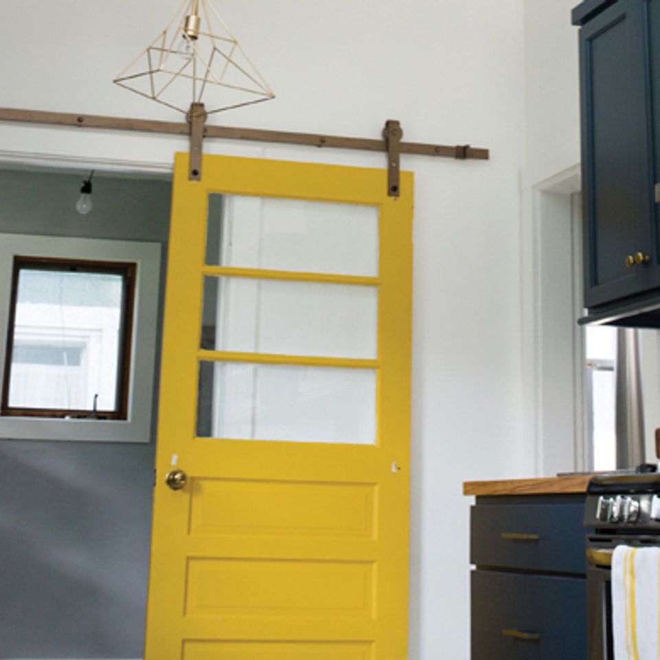 Nuredo magazine   tulsa oklahoma   remodeling   home upgrades that make cents   13953 intro   rolling yellow barn door in kitchen20180126 2580 119t7et