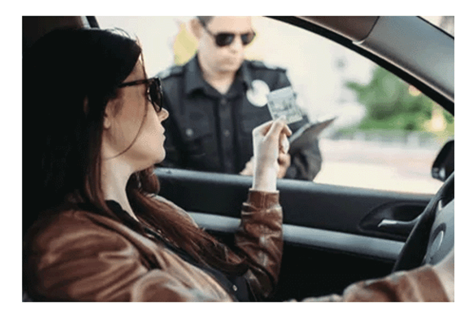 Woman showing police officer license