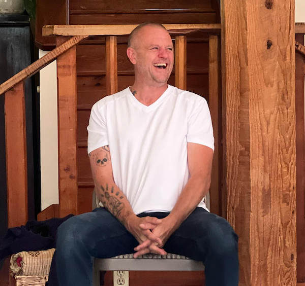 Steve tsonos in white tshirt teaching and laughing