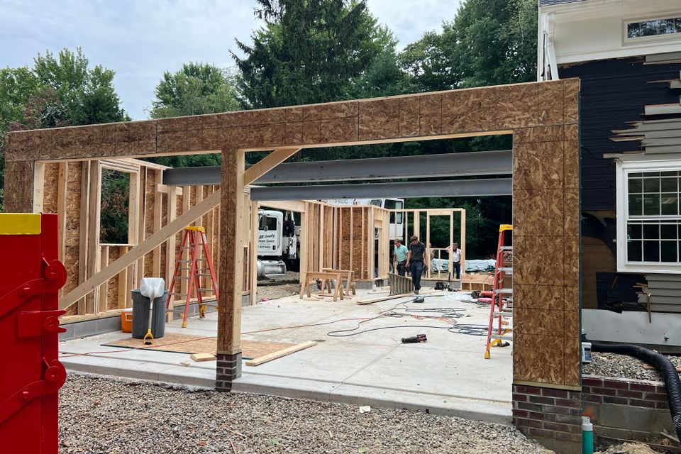 Existing garage and rear exterior before Chagrin Falls home renovation