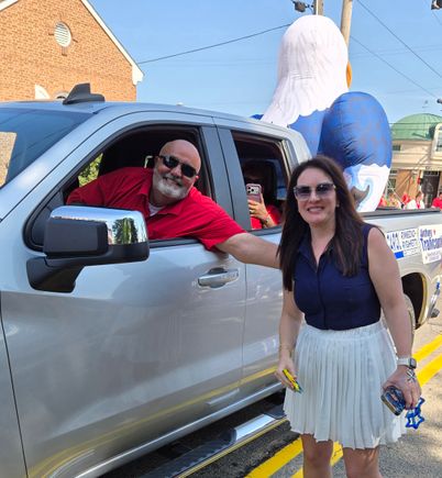Community members riding in a truck during a Mahoning Valley Fourth of July parade.
